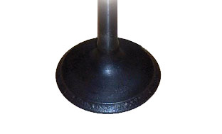 Pitted valve face surface